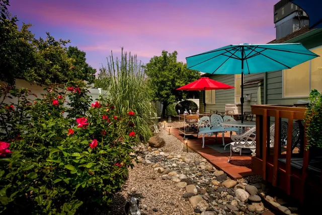 an aerial view of residential houses with outdoor space and street view