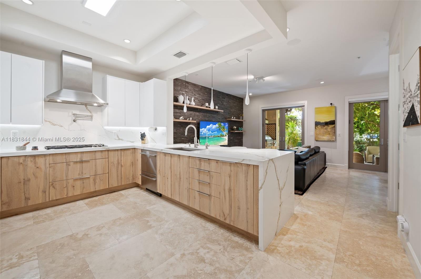 7560 Southwest 56th Court Miami, FL 33143 - Photo 11 of 60 a kitchen with stainless steel appliances sink cabinets and window