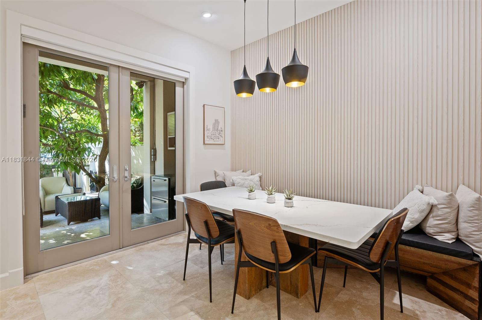 7560 Southwest 56th Court Miami, FL 33143 - Photo 13 of 60 a view of a dining room with furniture window and wooden floor