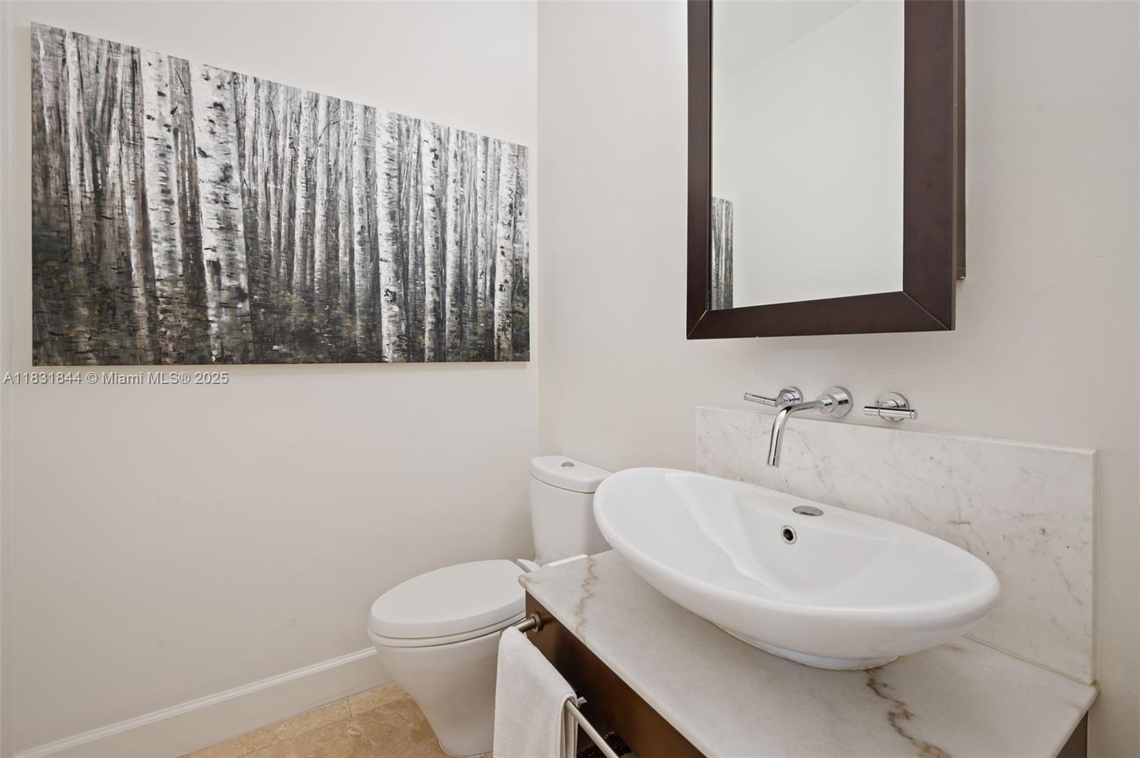 7560 Southwest 56th Court Miami, FL 33143 - Photo 14 of 60 a bathroom with a sink a toilet and mirror