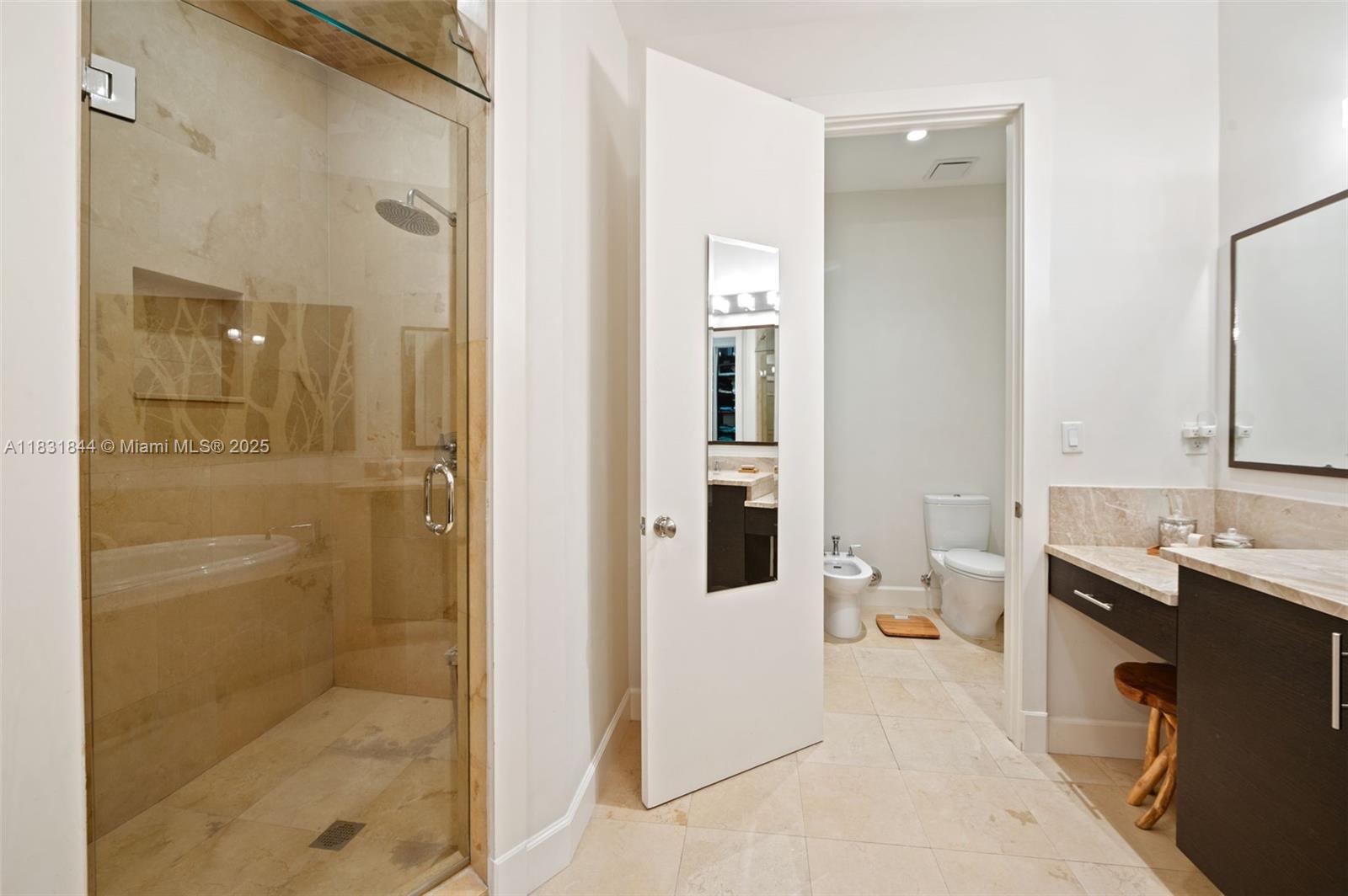 7560 Southwest 56th Court Miami, FL 33143 - Photo 32 of 60 a bathroom with a bathtub sink mirror and toilet