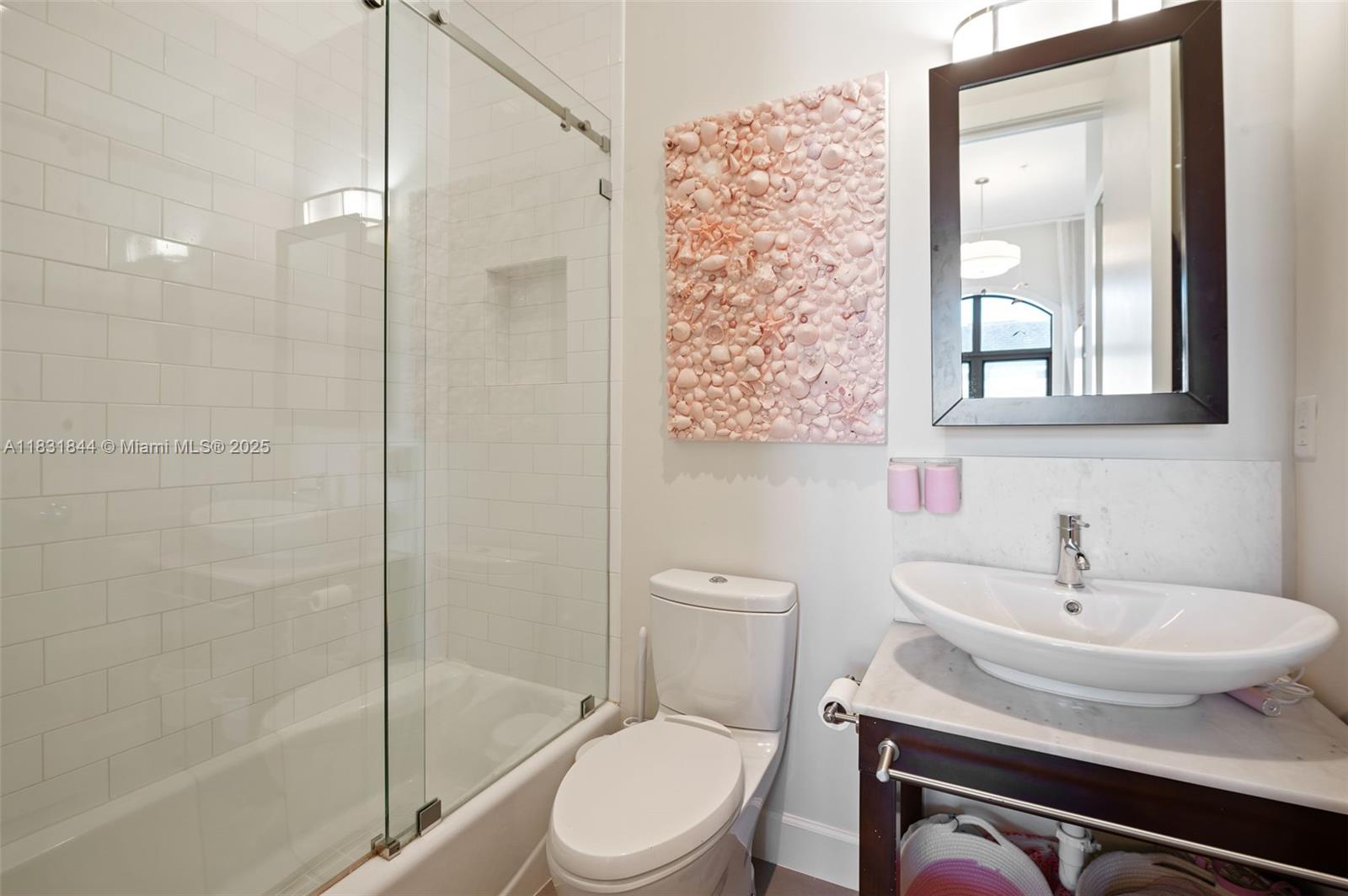 7560 Southwest 56th Court Miami, FL 33143 - Photo 34 of 60 a bathroom with a sink toilet and shower