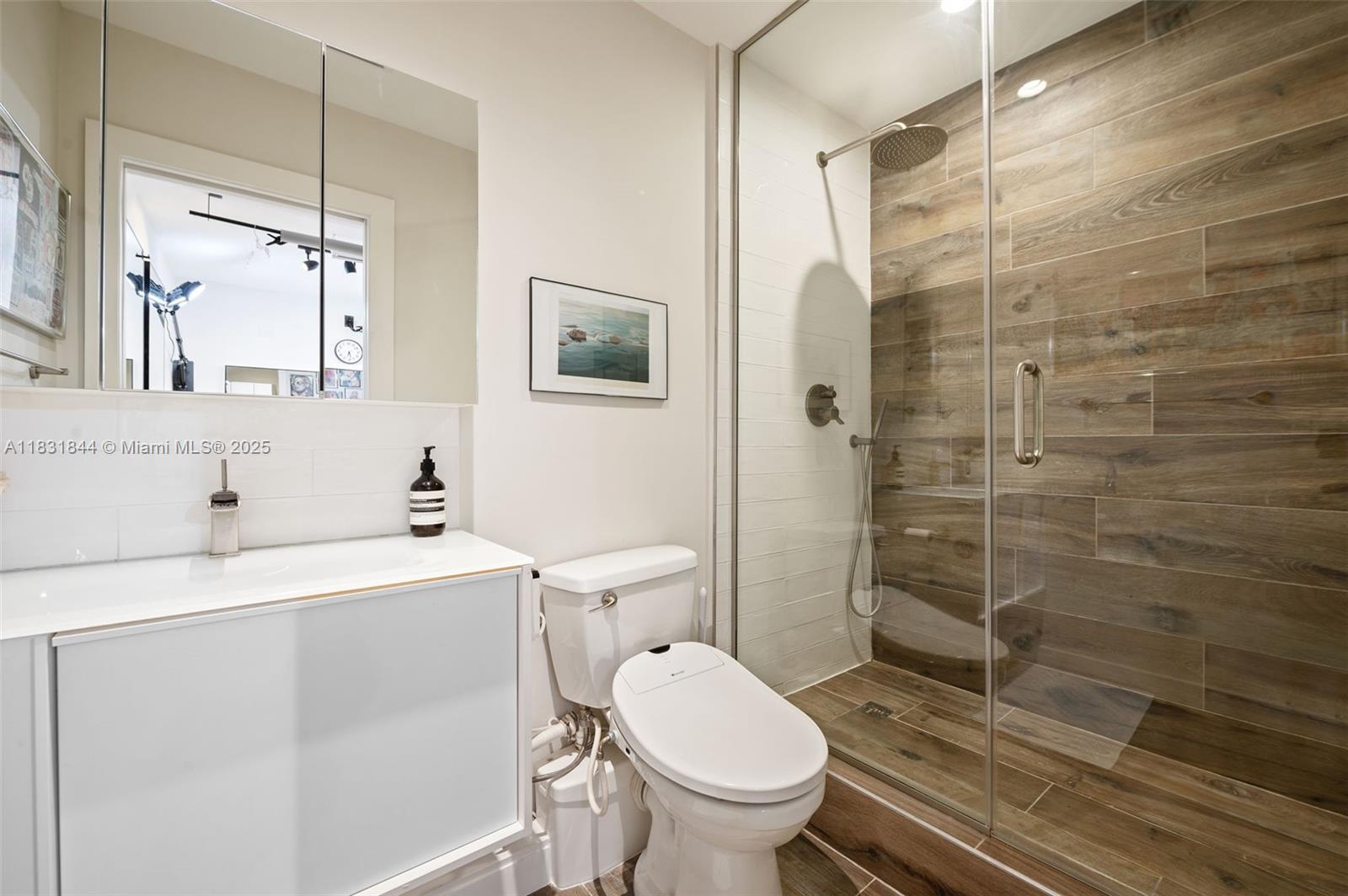 7560 Southwest 56th Court Miami, FL 33143 - Photo 41 of 60 a bathroom with a sink toilet and shower
