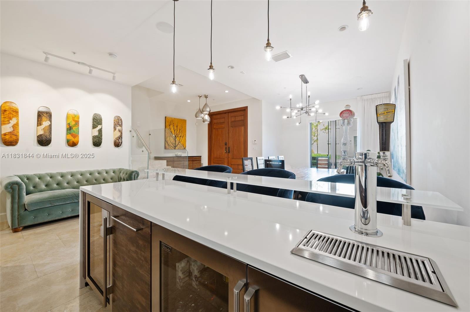 7560 Southwest 56th Court Miami, FL 33143 - Photo 5 of 60 a kitchen with a sink a counter and chairs