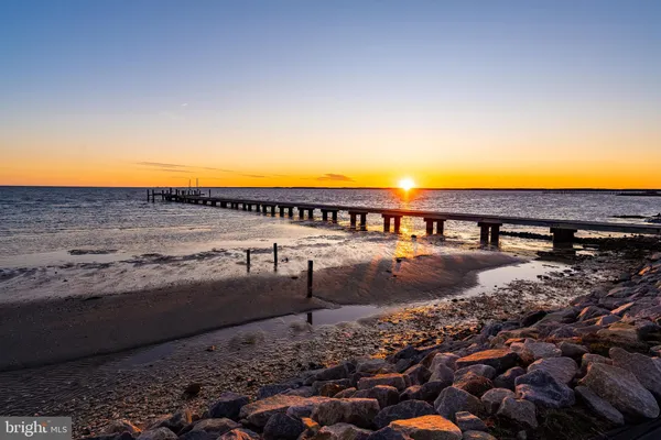 a living room with furniture or couch and a chandelier