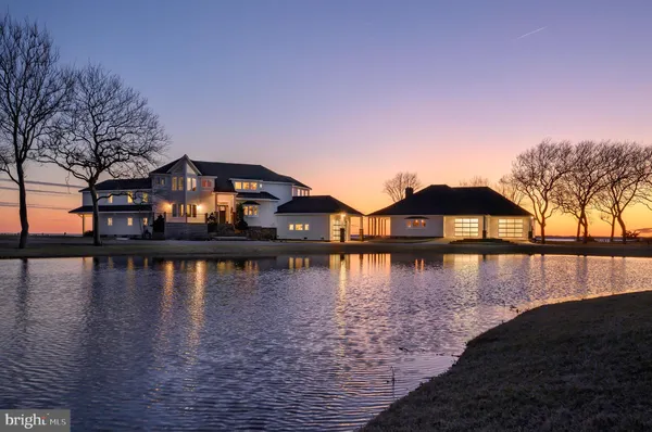 a living room with furniture ceiling fan and a rug