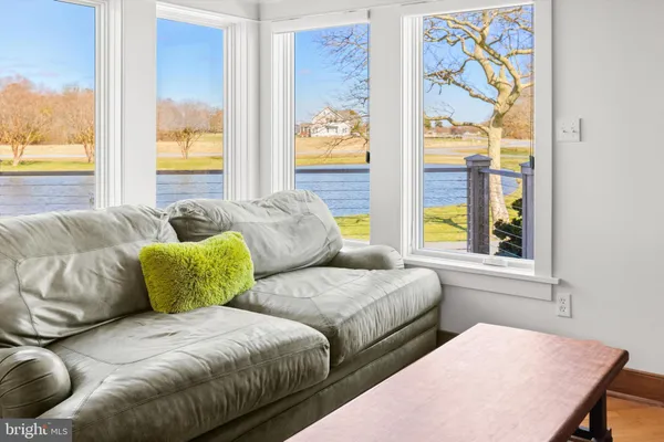 a view of a swimming pool with outdoor seating and yard