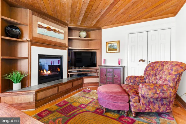 an aerial view of a house with a yard and lake view