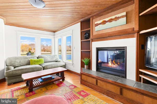 a front view of a house with a yard and swimming pool