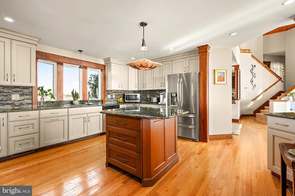 a view of a swimming pool with an outdoor seating