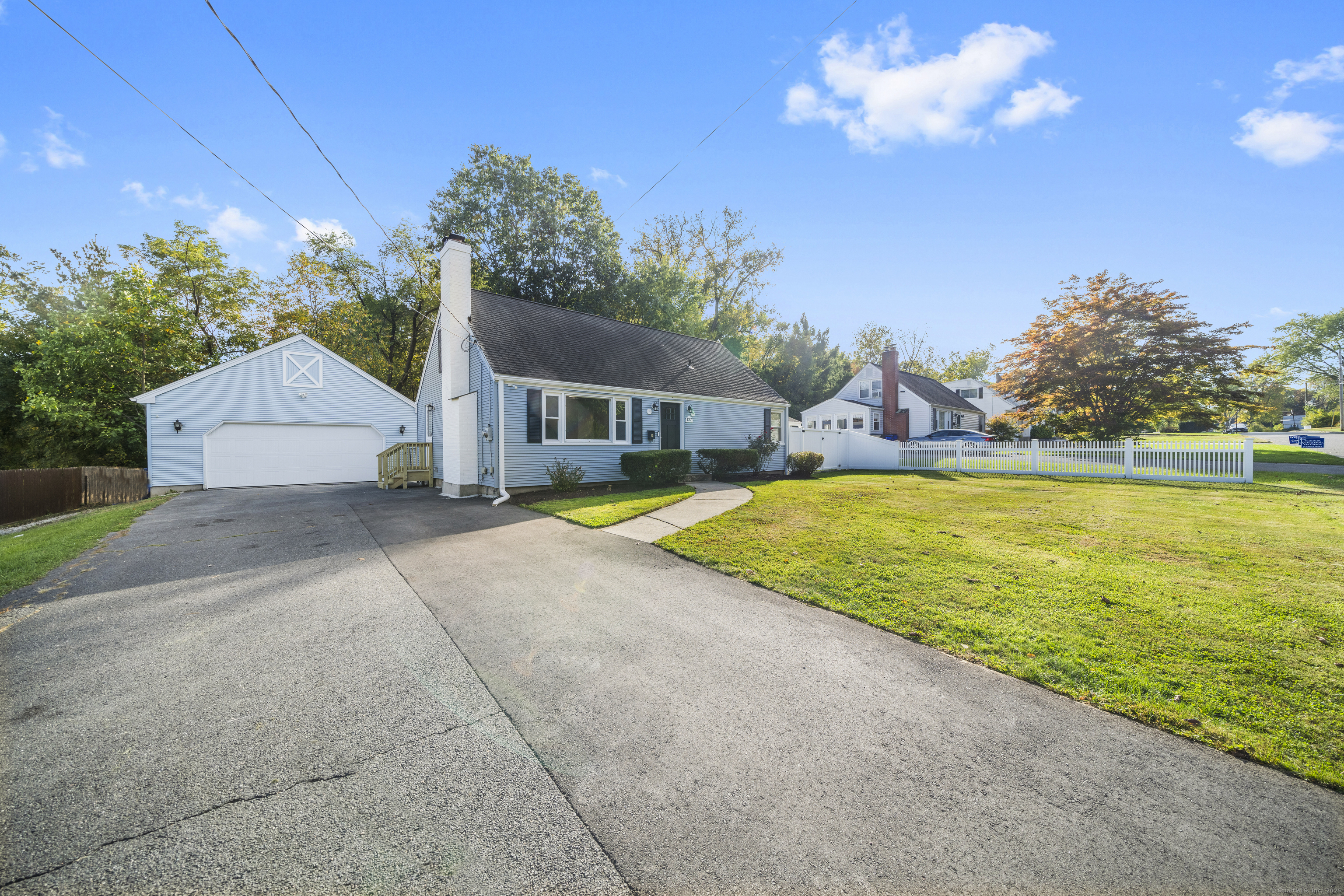 a view of a house with swimming pool and a yard