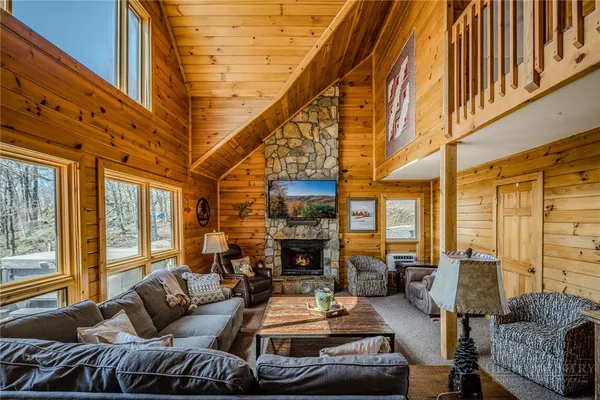 a bedroom with two beds and a chandelier