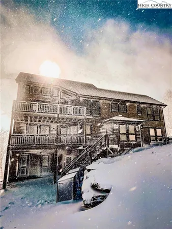 a balcony with table and chairs