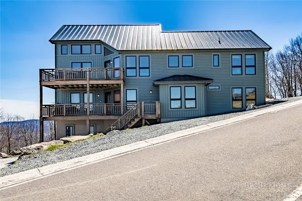 a view of a kitchen with a sink and cabinets