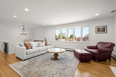 a living room with furniture and a rug