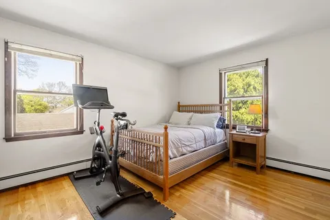 a bed room with a bed and a window