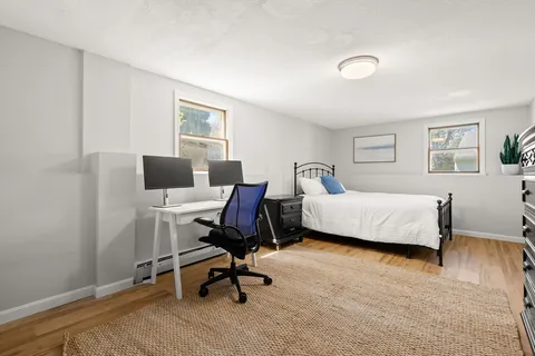 a bedroom with a workspace