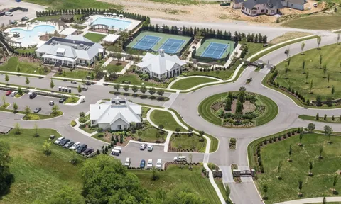 an aerial view of a house with outdoor space