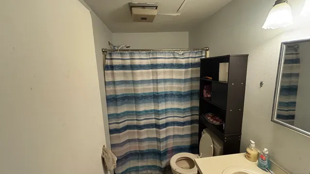 a bathroom with a sink and a shower