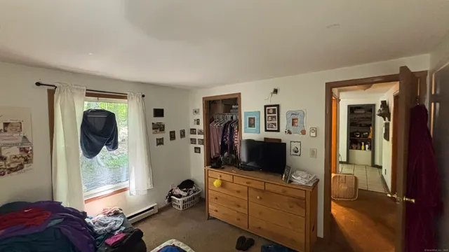 a room with furniture and a mirror