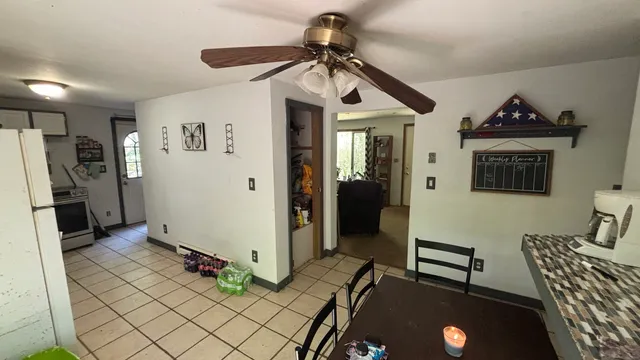 a view of a livingroom with furniture and windows