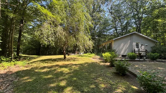 a house view with a backyard space