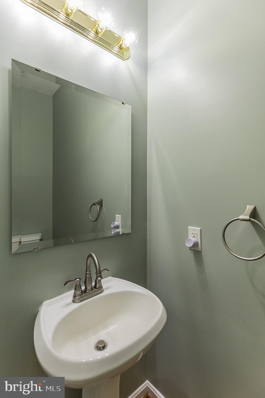 2750 Dalrymple Road Sunderland, MD 20689 - Photo 12 of 28 a bathroom with a sink and a mirror