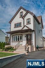 310 Union Street Carlstadt, NJ 07072 - Photo 2 of 24 a front view of a house with garden