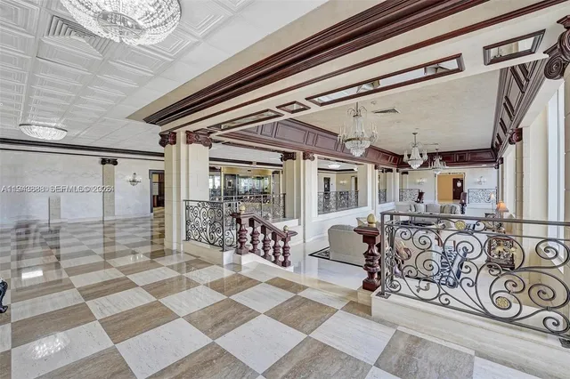 a view of a livingroom with furniture and floor to ceiling window