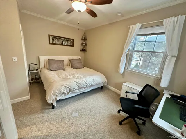 a bedroom with a bed and a chair