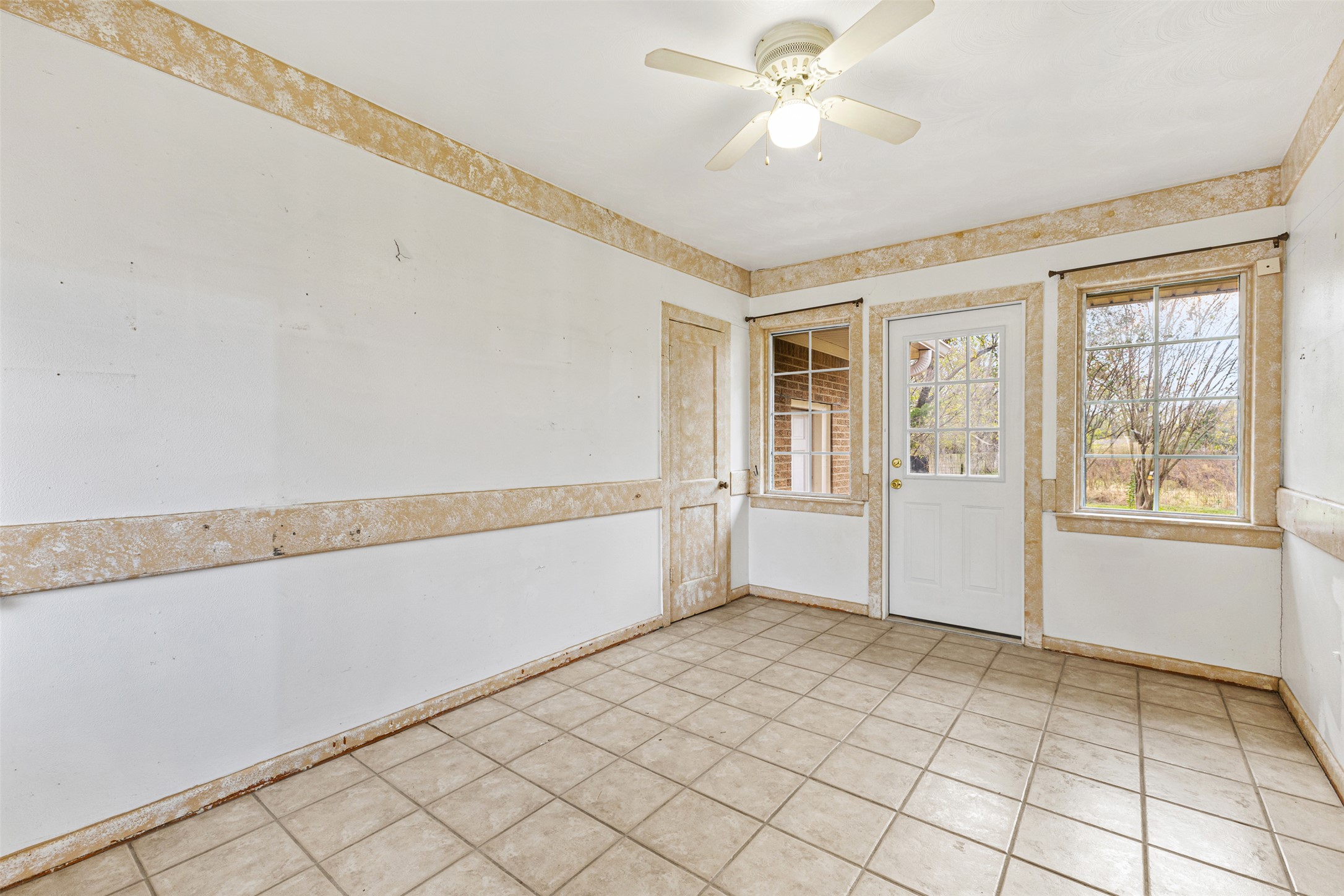 195 L County Road Jewett, TX 75846 - Photo 19 of 26 a view of an empty room with window and chandelier fan