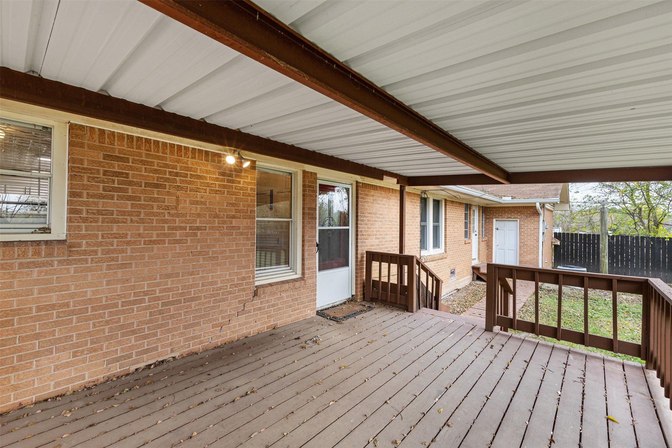 195 L County Road Jewett, TX 75846 - Photo 20 of 26 a view of a patio with table and chairs and wooden floor
