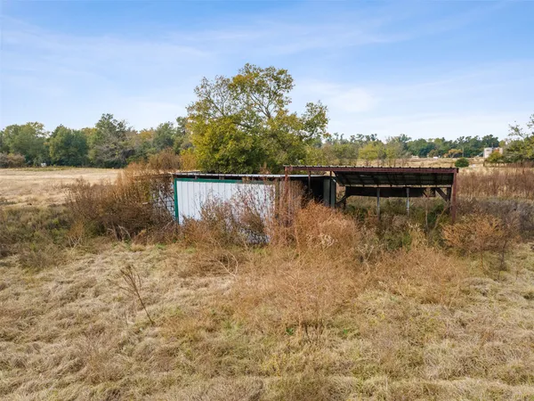 a view of a lake with houses in the back