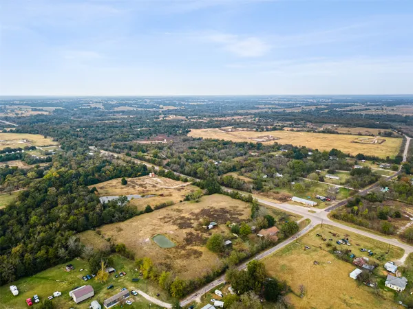 an aerial view of residential building and ocean