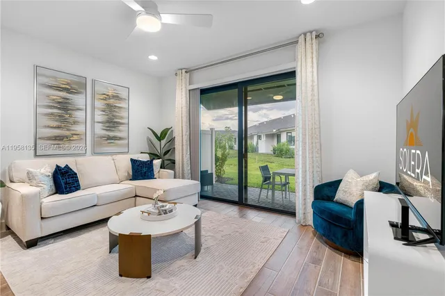 a living room with furniture and a large window
