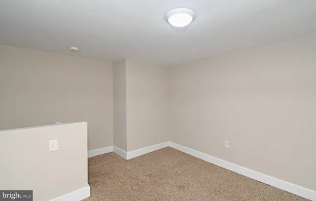 a view of livingroom with hardwood floor and hallway