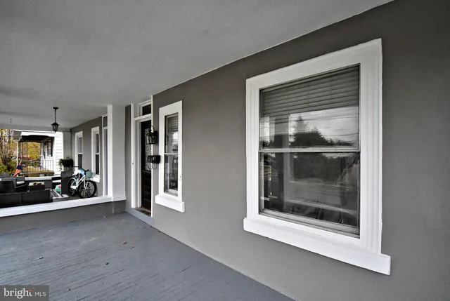 a view of a living room with a large window