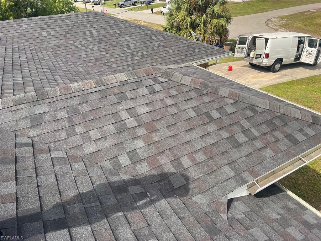 3513 30th Street Southwest Lehigh Acres, FL 33976 - Photo 11 of 29 a terrace with a sink and trees in the background