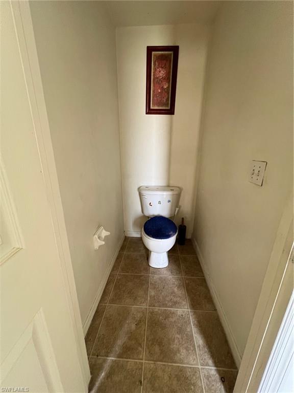 3513 30th Street Southwest Lehigh Acres, FL 33976 - Photo 23 of 29 a bathroom with a toilet and a shower
