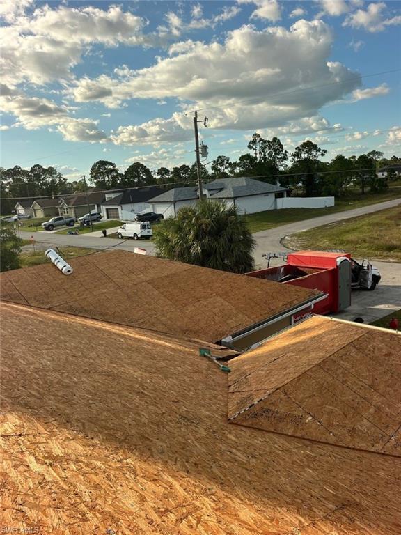 3513 30th Street Southwest Lehigh Acres, FL 33976 - Photo 3 of 29 a view of swimming pool with lake view and mountain in the back