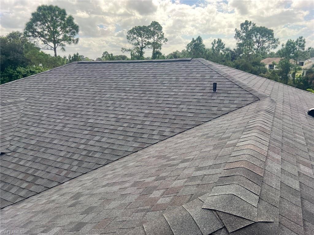 3513 30th Street Southwest Lehigh Acres, FL 33976 - Photo 8 of 29 a backyard of a house