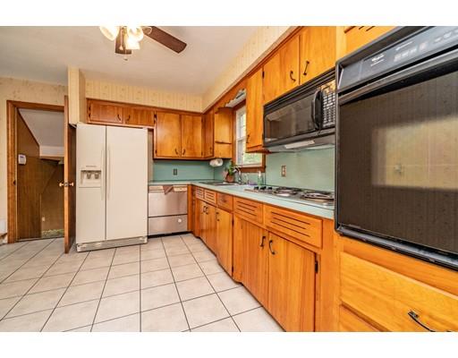 117 Woodland Road Springfield, MA 01129 - Photo 12 of 30 a kitchen with stainless steel appliances granite countertop a refrigerator and a stove top oven