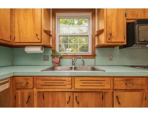 117 Woodland Road Springfield, MA 01129 - Photo 14 of 30 a kitchen with stainless steel appliances granite countertop a sink and cabinets