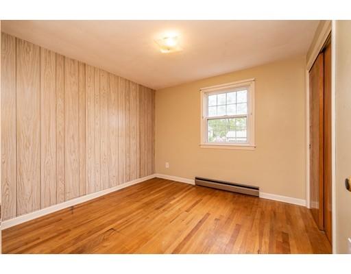 117 Woodland Road Springfield, MA 01129 - Photo 17 of 30 a view of an empty room with wooden floor and a window
