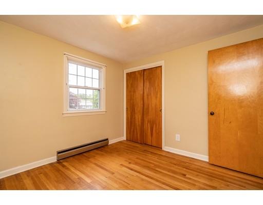 117 Woodland Road Springfield, MA 01129 - Photo 18 of 30 a view of an empty room with wooden floor and a window