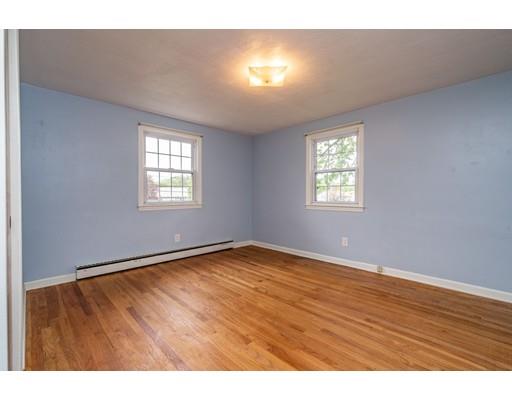 117 Woodland Road Springfield, MA 01129 - Photo 20 of 30 a view of an empty room with wooden floor and a window