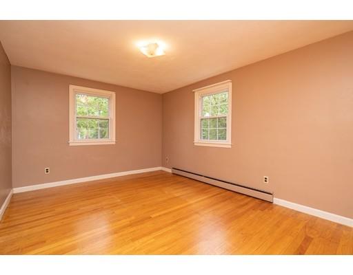 117 Woodland Road Springfield, MA 01129 - Photo 23 of 30 a view of an empty room with wooden floor and a window