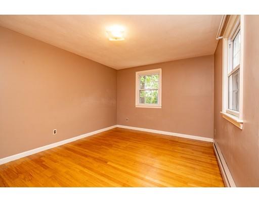117 Woodland Road Springfield, MA 01129 - Photo 25 of 30 a view of an empty room with wooden floor and a window