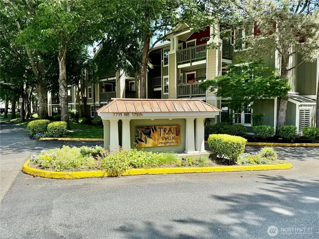 a view of a house with swimming pool and sitting area