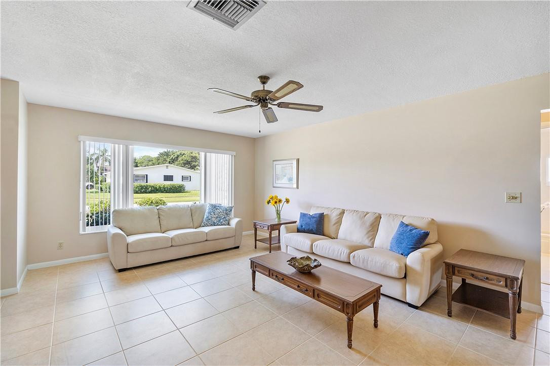 6419 Hitchin Post Way Delray Beach, FL 33484 - Photo 11 of 33 a living room with furniture and a window